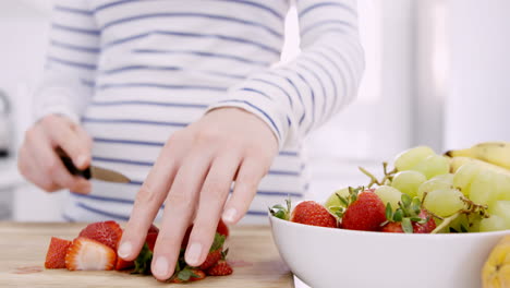 Woman-cutting-fruits