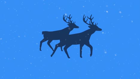 nieve cayendo sobre la silueta de dos renos caminando contra un fondo azul