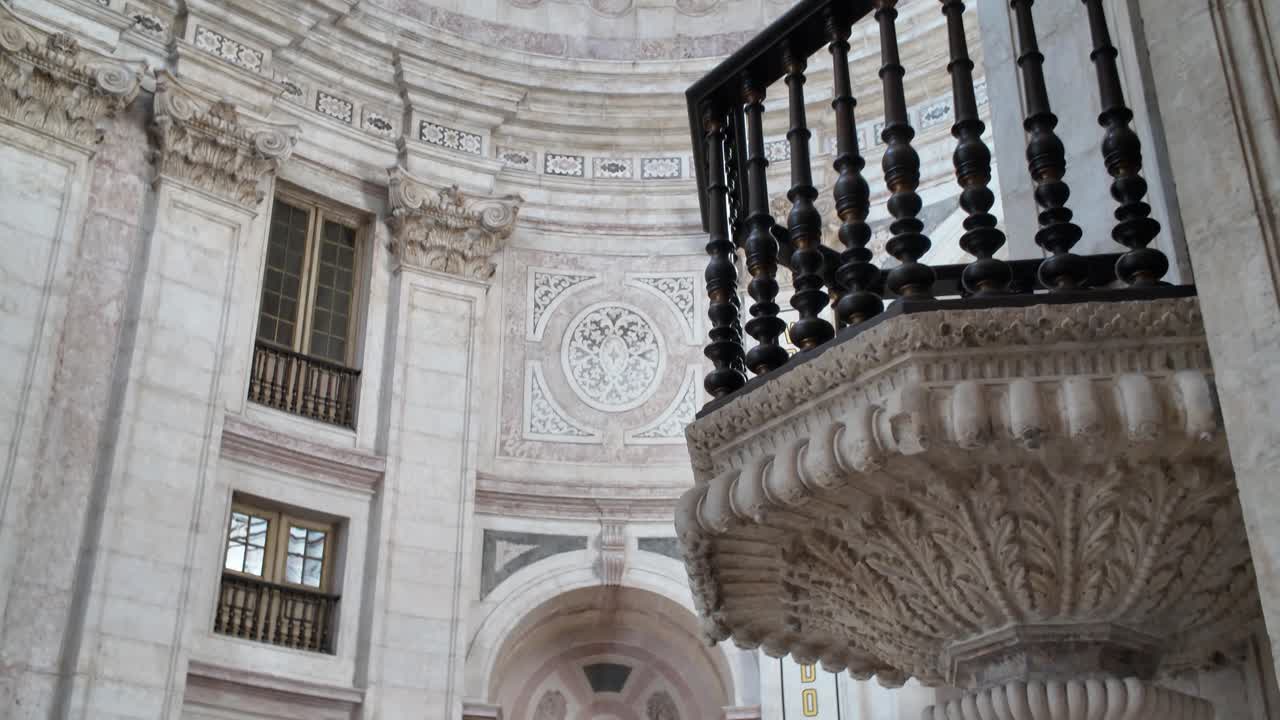 Intricate marble pulpit under grand dome in National Pantheon Lisbon