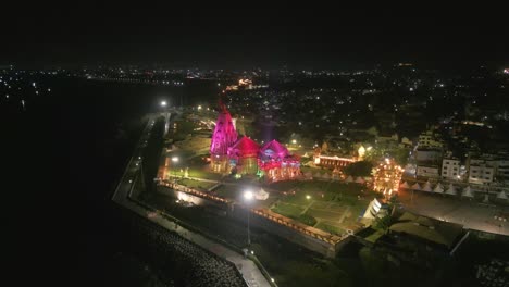 aerial night view of illuminated temple on the coast of india