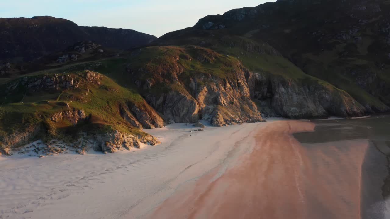 Ascending Aerial View of Maghera Beach With Soft Golden Hour Light and Gradual Camera Tilt Down