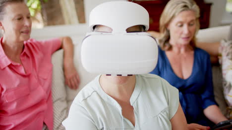 Senior-Asian-woman-experiences-virtual-reality-at-home