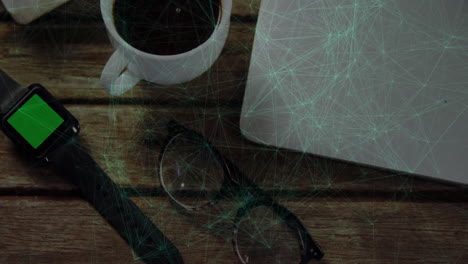 network of connections and data processing animation over coffee and laptop