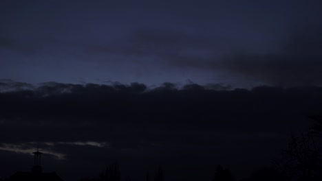 cumulonimbus cloud moving at sunset sky time lapse silhouette clock tower