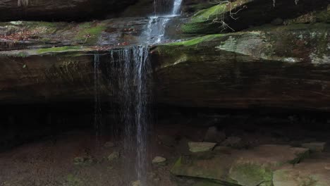 waterfall aerial pulling out to reveal