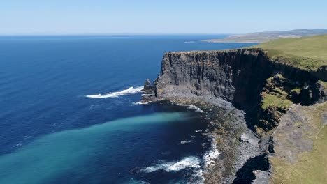 a drone shot of the cliffs of moher, the tallest sea cliffs of the rugged west clare coast of ireland