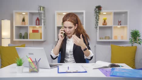 Home-office-worker-woman-phone-angry-performs-business-call.