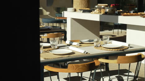 restaurant table for lunch on a sunny day, creating a sophisticated dining experience in the bright ambiance