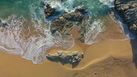 aerial image with drone of lloret de mar virgin beach with green vegetation in mediterranean sea turquoise water overhead view