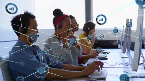 Animation-of-network-of-digital-icons-over-diverse-colleagues-talking-on-phone-headset-at-office