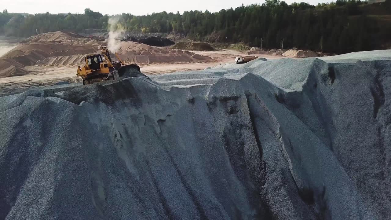 Quarry Operation with Bulldozer and Trucks