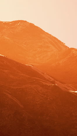 orange sunset over mountain peak