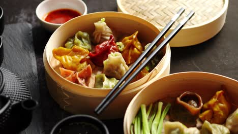 oriental traditional chinese dumplings served in the wooden steamer