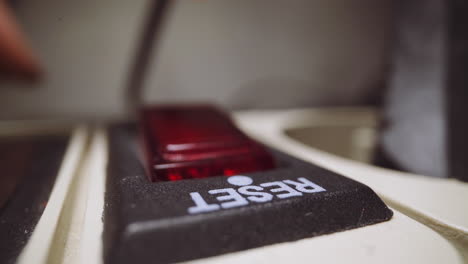 woman presses button reset on network filter in light room