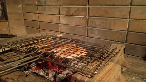 Slow-Motion-Shot-of-Man-Closing-Grilling-Basket-with-Seasoned-Chicken-Inside-and-Flipping-on-Charcoal-BBQ-at-Night