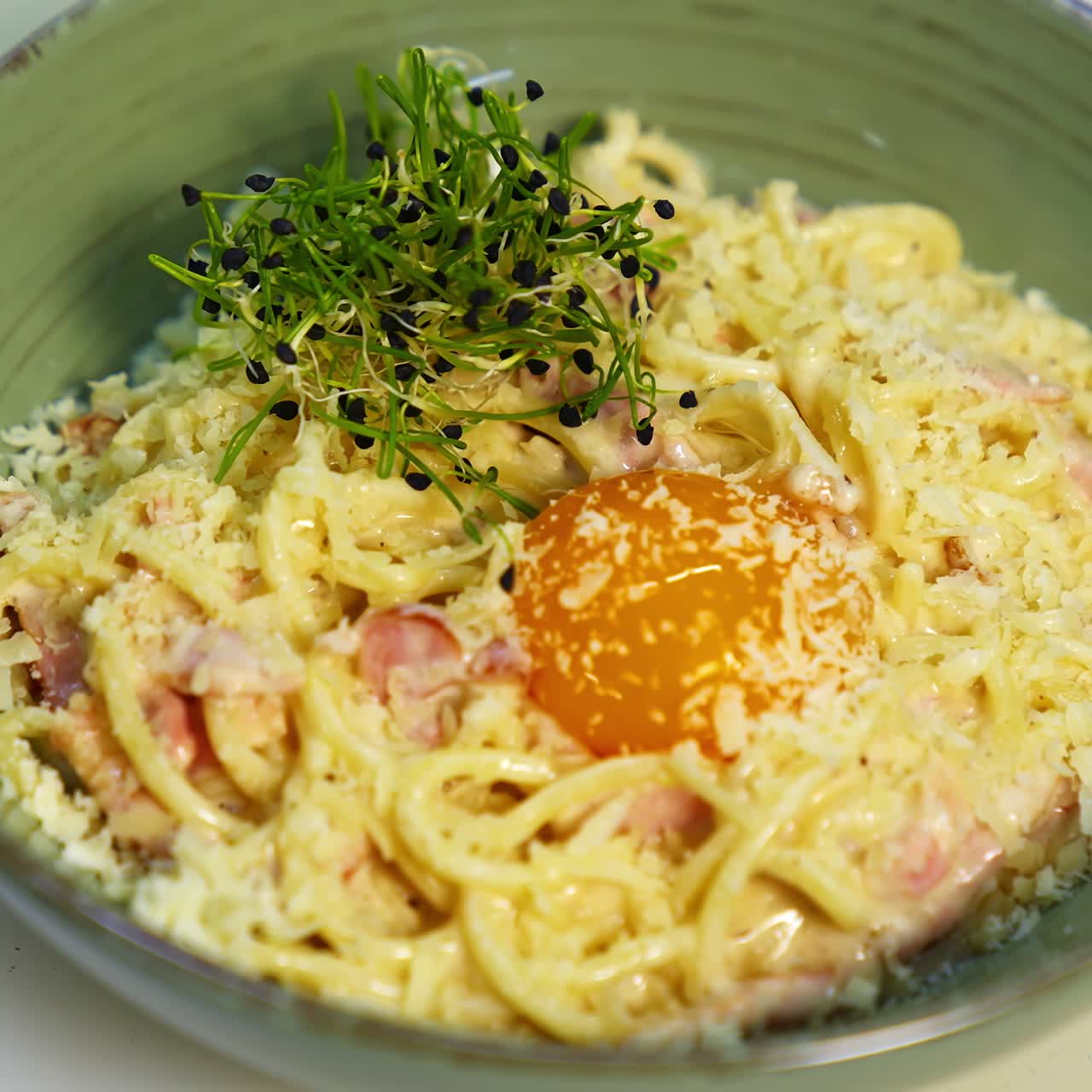 Tasty appetizer in a plate. Chef decorating delicious dish with green sprouts. Healthy food. Preparation of food in a restaurant