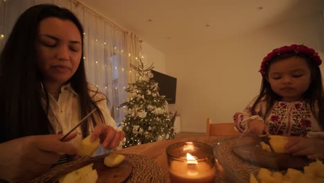 mother and daughter preparing for christmas celebration