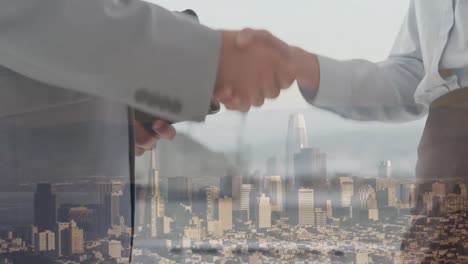 animation of businessman handshake over cityscape