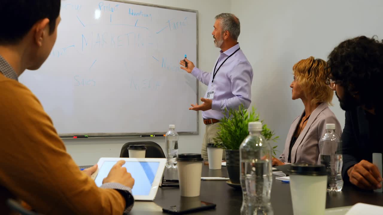 Businessman giving presentation in conference room 4k