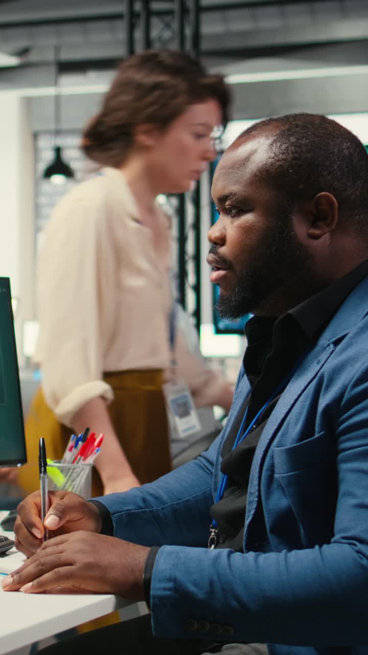 Vertical Video Black business consultant taking notes to create a new strategy