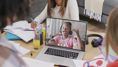 composition of diverse students on laptop online learning with african american schoolgirl