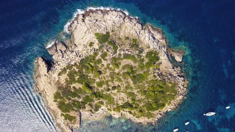 overhead drone shot of an islet near playa de san telmo, in canary group of islands, an autonomous area of spain in the atlantic ocean