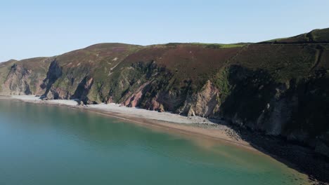 devon coast uk aerial footage of stunning rocky coast line on sunny summers day