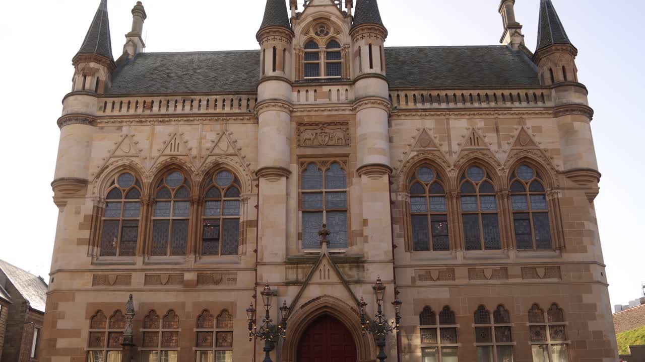 scottish flag waving above the peoples government town home in Inverness, Scotland in the Highlands