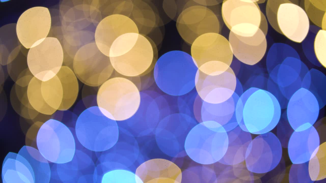 Moving blue and golden bokeh light background