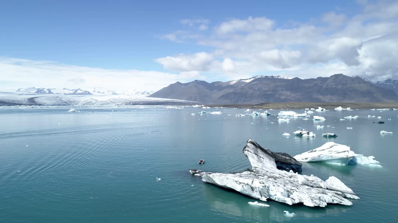 Icebergs and Boat on Jokulsarlon Glacier Lagoon, Iceland