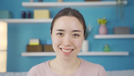 Close-up-happy-and-cheerful-Asian-young-woman.