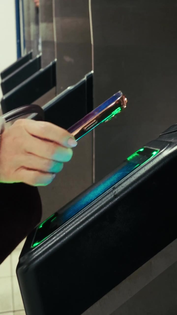 Close Up of Hand Tapping Contactless Card on NYC Subway OMNY Reader
Vertical 4K close-up of a person using a contactless phone NFC to pay for a fare at a New York City MTA subway turnstile.