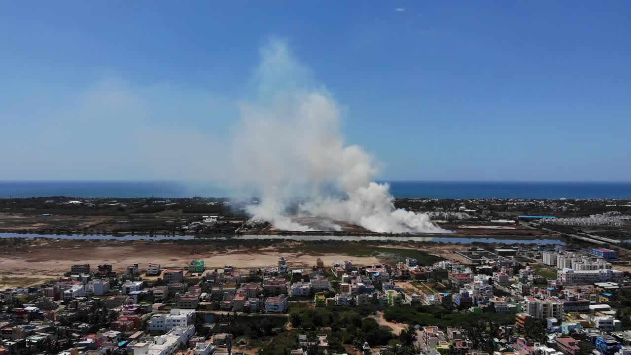 Aerial Over Chennai During Lockdown With Smoke Billowing In The Background. Follow Shot