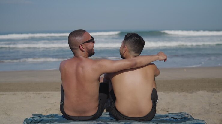 Gay Couple Relaxing on Beach