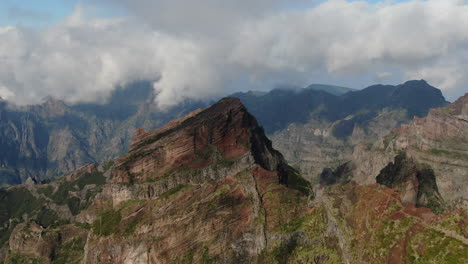 pico arieiro, madeira: aerial view traveling in over the majestic mountains of the area and on a sunny day