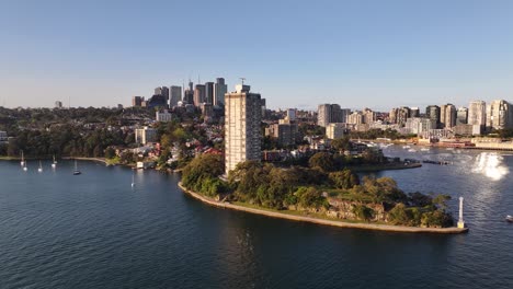 Real Estate building and Blue Point Reserve in North Sydney. Aerial cityscape, properties.