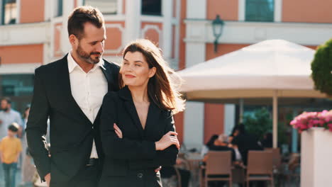 couple in business attire enjoying a city outing