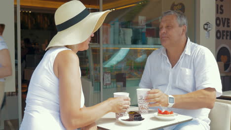 Couple-drinking-coffee-and-taking-selfie-on-smartphone