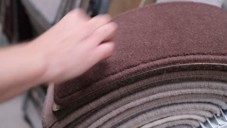 customer looks through carpet samples in a carpet shop