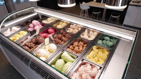 variety of ice cream flavors in a display case