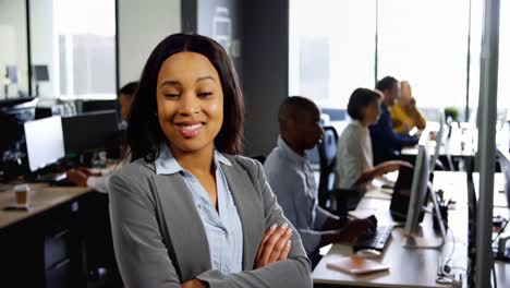 businesswoman standing with arms crossed in office 4k