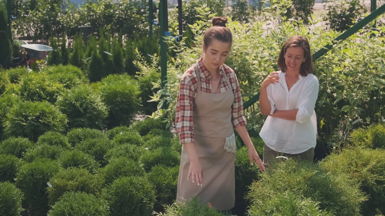 Two women in a garden center
