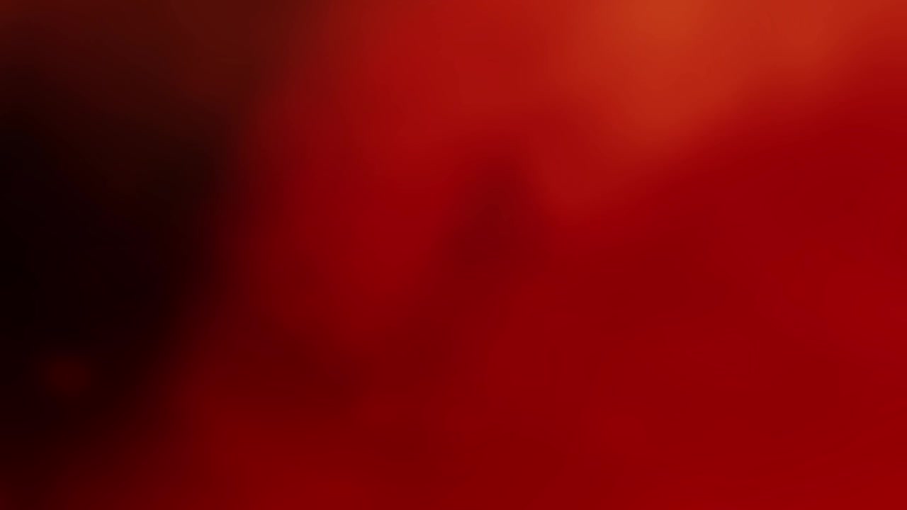 Fughe di luce astratte rosse e arancioni con effetto bokeh delicato