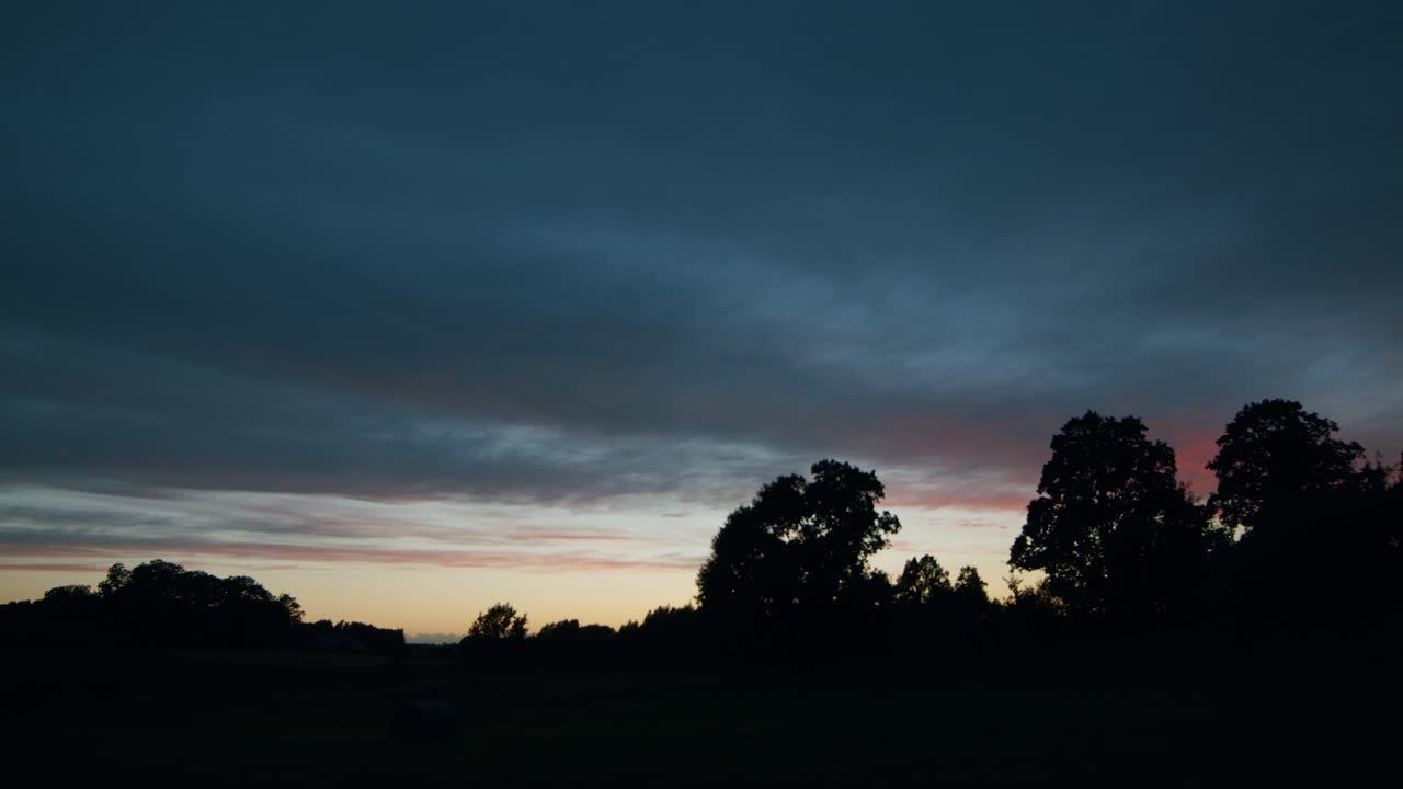 Fast moving high clouds on sunset red light