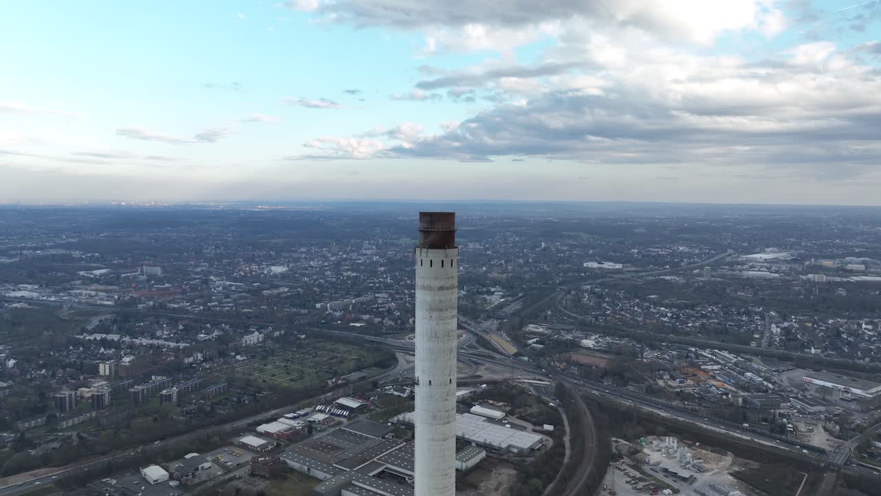Smoke stack industrial chimney, power plant. German ruhr area. Aerial view.