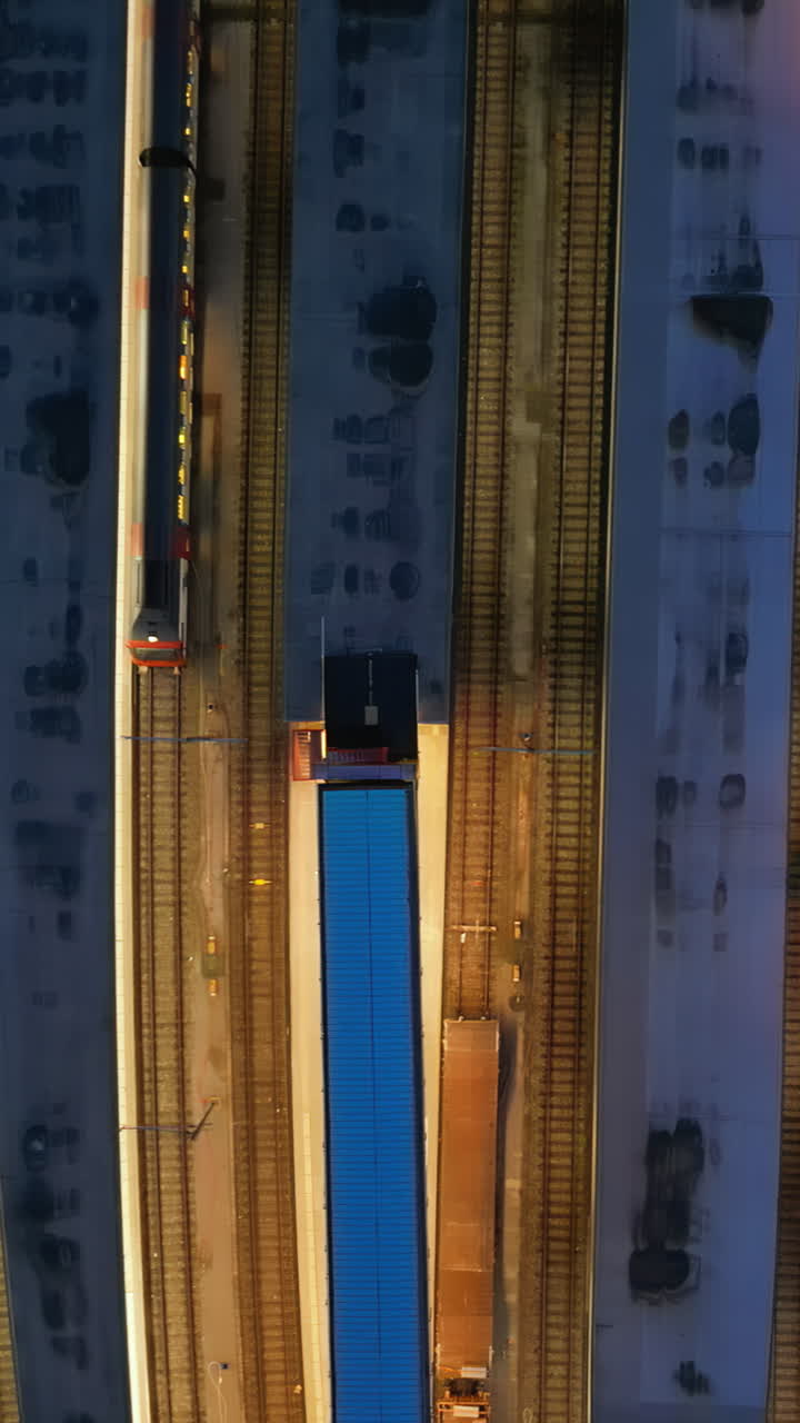 Aerial, drone view of the streets of Basel, Switzerland in the evening. Vertical