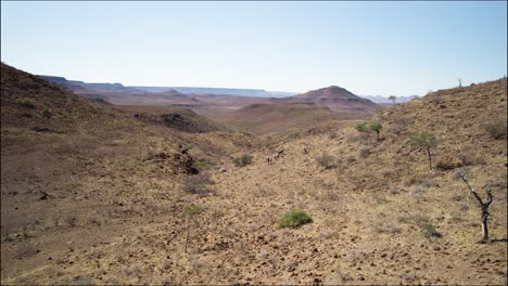 guided hiking trail in remote wilderness, arid landscape of namibia