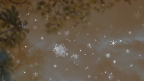 animation of snow flakes falling over trees on brown background