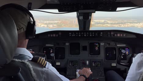 exclusive view of a middle size jet cockpit during the landing phase