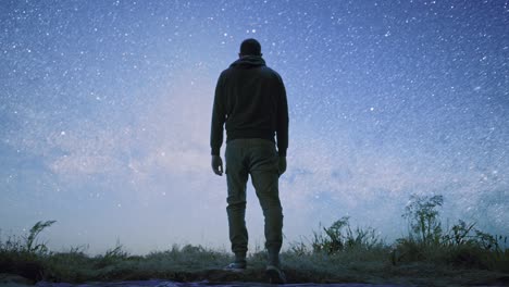 man contemplating the stars